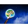 Close up of human hand holding Earth planet. Elements of this image are furnished by NASA