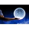 Close of man hands holding moon planet