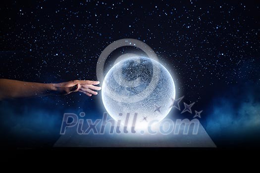 Close of man hands touching moon planet Close of man hands touching moon planet