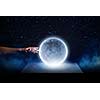 Close of man hands touching moon planet