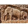 Elephants on descent of the Ganges and Arjuna's Penance ancient stone sculpture - monument at Mahabalipuram, Tamil Nadu, India