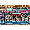 Shiva and Parvati on bull images. Sculptures on Hindu temple gopura tower. Meenakshi Temple, Madurai, Tamil Nadu, India