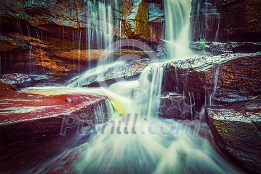 Vintage retro effect filtered hipster style image of tropical waterfall. Popokvil Waterfall, Bokor National Park, Cambodia Vintage retro effect filtered hipster style image of tropical waterfall. Popokvil Waterfall, Bokor National Park, Cambodia