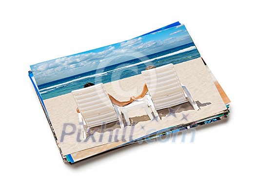 Holidays beach honeymoon concept creative background - stack of vacation photos with couple on beach image on top isolated on white background Holidays beach honeymoon concept creative background - stack of vacation photos with couple on beach image on top isolated on white background