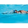 Athletic Man swimming in the pool