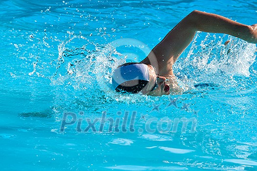 Athletic Man swimming in the pool Athletic Man swimming in the pool