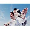double exposure of romantic young couple and sky clouds
