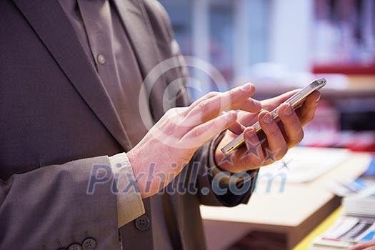 close up photo of business man work on phone at office close up photo of business man work on phone at office
