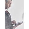 double exposure of business man working on laptop computer and abstract programming code numbers