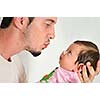 indoor portrait with happy young famil and  cute little babby 