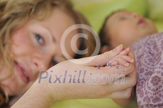 beautiful young mother hold small children hand beautiful young mother hold small children hand