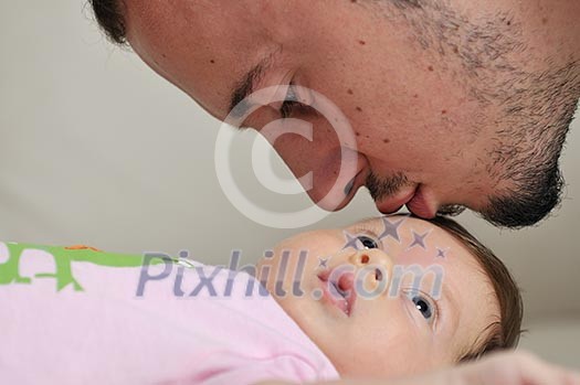 indoor portrait with happy young famil and cute little babby indoor portrait with happy young famil and cute little babby
