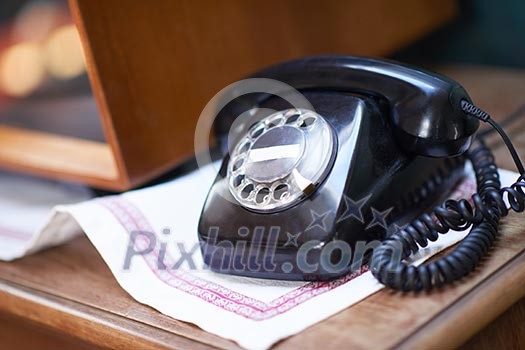 retro vintage black cable telephone on old wooden table retro vintage black cable telephone on old wooden table