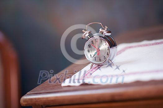 vintage retro old clock at wooden table vintage retro old clock at wooden table