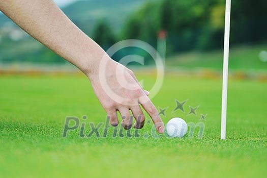 golf ball on sports golf course and hole golf ball on sports golf course and hole