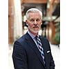 portrait of senior business man with grey beard and hair alone i modern office indoors