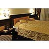 modern hotel room appartment indoor with double bed and lcd tv
