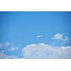 modern airplane travel,  clear blue sky in background