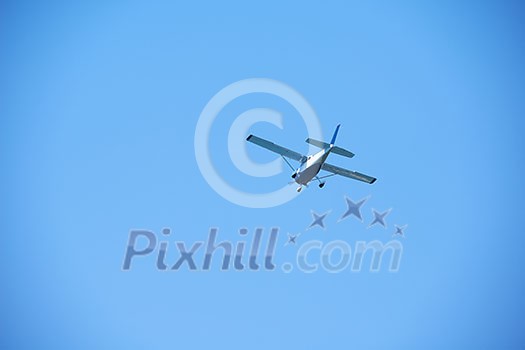 small retro airplane, clear blue sky in background small retro airplane, clear blue sky in background