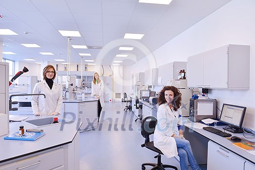 group of scientists working at the laboratory group of scientists working at the laboratory