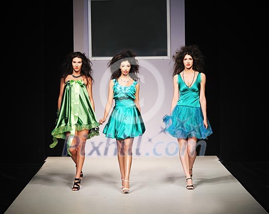 young beautiful model walking on fashion show piste young beautiful model walking on fashion show piste