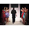 young successful fashion designer on the end of fashion show