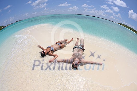 happy young romantic couple in love have fun and relaxing on beautiful beach happy young romantic couple in love have fun and relaxing on beautiful beach