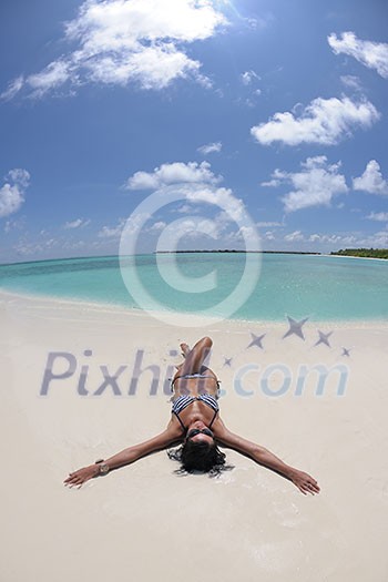 beautiful and happy young woman on beach have fun and relax on summer vacation over the crystal clear sea beautiful and happy young woman on beach have fun and relax on summer vacation over the crystal clear sea