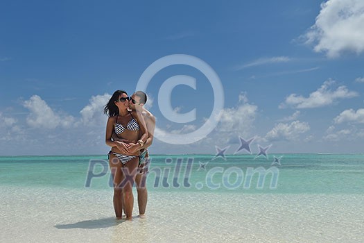 happy young romantic couple in love have fun and relaxing on beautiful beach happy young romantic couple in love have fun and relaxing on beautiful beach