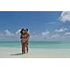 happy young romantic couple in love have fun and relaxing on beautiful beach