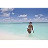 beautiful and happy young woman on beach have fun and relax on summer vacation  over the crystal clear sea