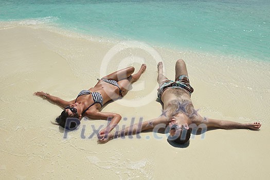 happy young romantic couple in love have fun and relaxing on beautiful beach happy young romantic couple in love have fun and relaxing on beautiful beach