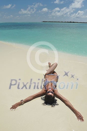 beautiful and happy young woman on beach have fun and relax on summer vacation over the crystal clear sea beautiful and happy young woman on beach have fun and relax on summer vacation over the crystal clear sea