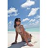 beautiful and happy young woman on beach have fun and relax on summer vacation  over the crystal clear sea