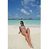 beautiful and happy young woman on beach have fun and relax on summer vacation  over the crystal clear sea