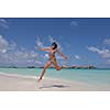 beautiful and happy young woman on beach have fun and relax on summer vacation  over the crystal clear sea
