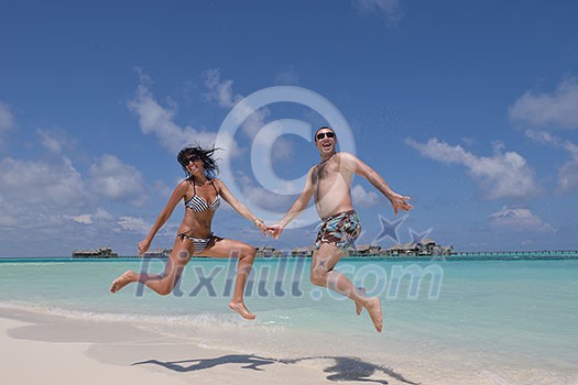 happy young romantic couple in love have fun and relaxing on beautiful beach happy young romantic couple in love have fun and relaxing on beautiful beach