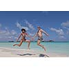 happy young romantic couple in love have fun and relaxing on beautiful beach