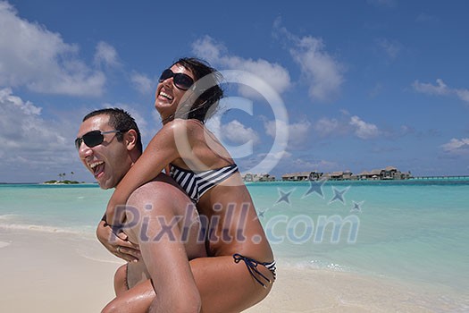 happy young romantic couple in love have fun and relaxing on beautiful beach happy young romantic couple in love have fun and relaxing on beautiful beach