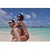 happy young romantic couple in love have fun and relaxing on beautiful beach
