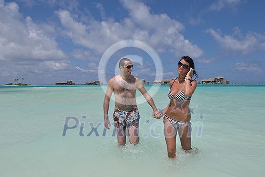 happy young romantic couple in love have fun and relaxing on beautiful beach happy young romantic couple in love have fun and relaxing on beautiful beach