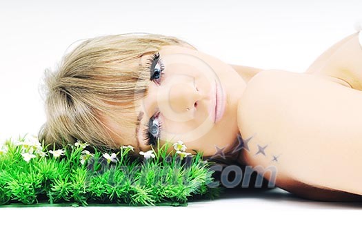 beautiful blonde woman face isolated on white with small green peace of grass beautiful blonde woman face isolated on white with small green peace of grass
