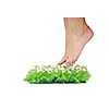 woman legs walking on small peace of green grass isolated on white representing last oasis concept