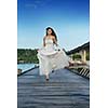 asian  bride with a veil on the beach in the sky and blue sea. honeymoon on the fantastic island at summer