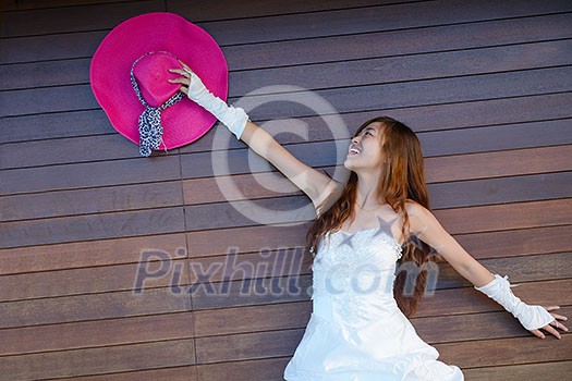 asian bride with a veil on the beach in the sky and blue sea. honeymoon on the fantastic island at summer asian bride with a veil on the beach in the sky and blue sea. honeymoon on the fantastic island at summer