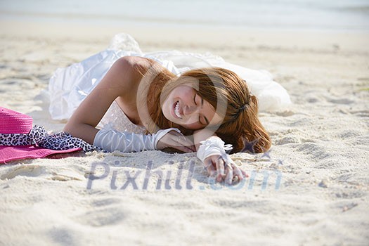 asian bride with a veil on the beach in the sky and blue sea. honeymoon on the fantastic island at summer asian bride with a veil on the beach in the sky and blue sea. honeymoon on the fantastic island at summer