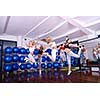 happy girls jumping in fitness cloub