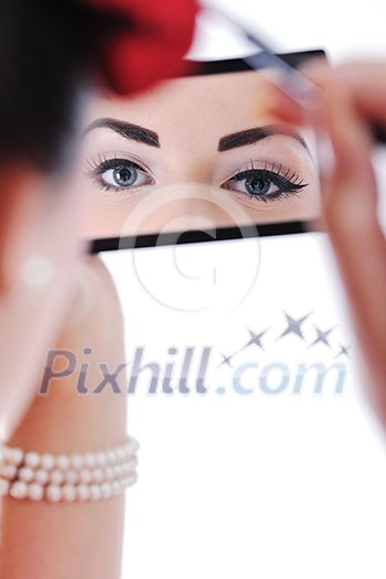 beautiful young pinup woman apply makeup and cosmetics beauty treatment isolated on white in studio beautiful young pinup woman apply makeup and cosmetics beauty treatment isolated on white in studio