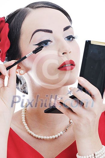 beautiful young pinup woman apply makeup and cosmetics beauty treatment isolated on white in studio beautiful young pinup woman apply makeup and cosmetics beauty treatment isolated on white in studio