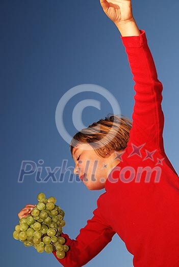 happy girl with grape outside happy girl with grape outside
